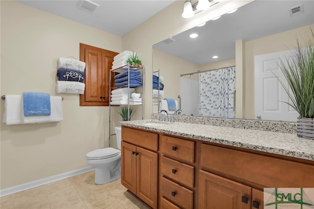 bathroom with vanity, curtained shower, tile patterned floors, and toilet