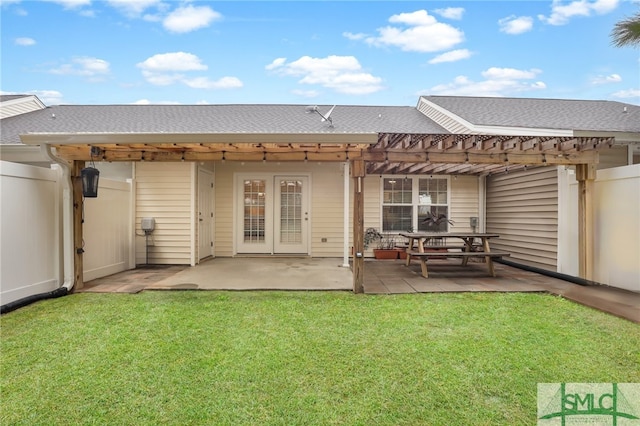 rear view of house featuring a patio, a yard, and a pergola