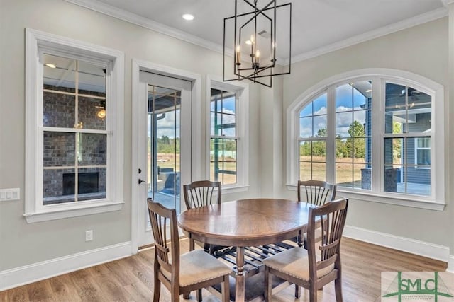 1495 Lillie Hagan Rd, Brooklet, GA 30415 - dining area with wood finished floors, ornamental molding, and a chandelier