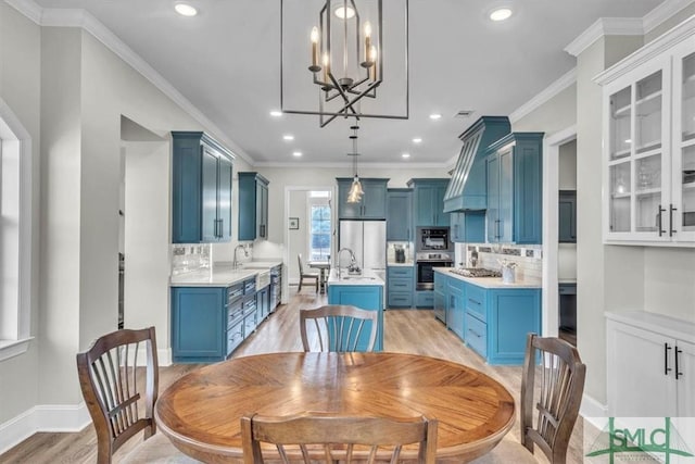 1495 Lillie Hagan Rd, Brooklet, GA 30415 - dining space featuring light wood-style flooring, a chandelier, recessed lighting, and ornamental molding
