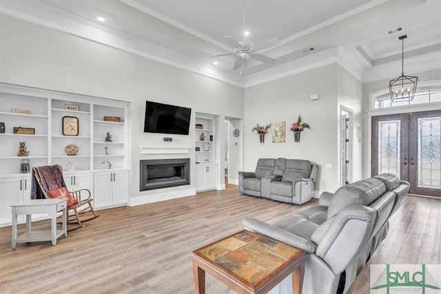 1495 Lillie Hagan Rd, Brooklet, GA 30415 - living area with light wood-style floors, ornamental molding, a fireplace, recessed lighting, and a towering ceiling