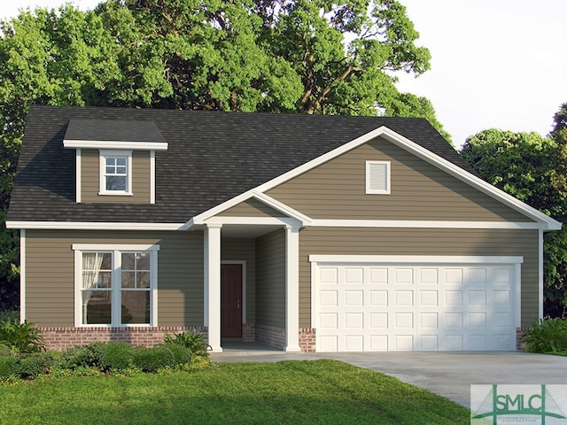 view of front of house with a front lawn and a garage