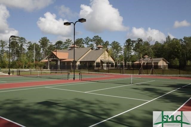 view of sport court featuring community basketball court and fence