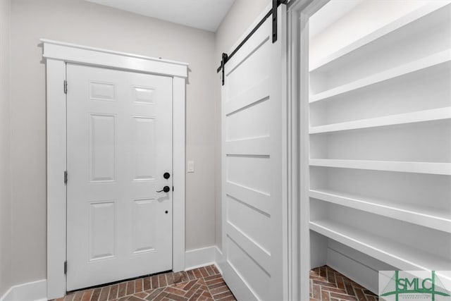 doorway to outside featuring a barn door