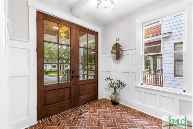 doorway to outside featuring a wealth of natural light and french doors