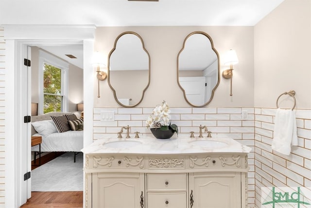 bathroom featuring vanity and hardwood / wood-style flooring