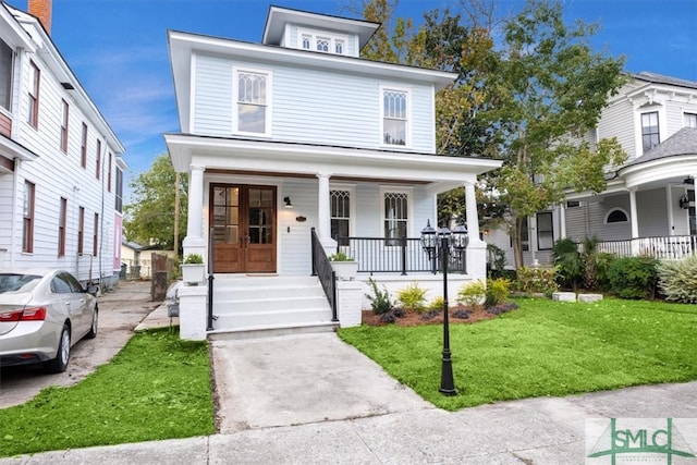 view of front of property with a porch and a front yard