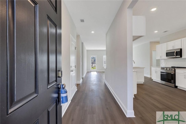 entrance foyer featuring dark hardwood / wood-style floors