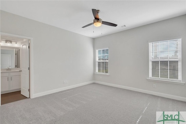 interior space featuring ceiling fan and carpet