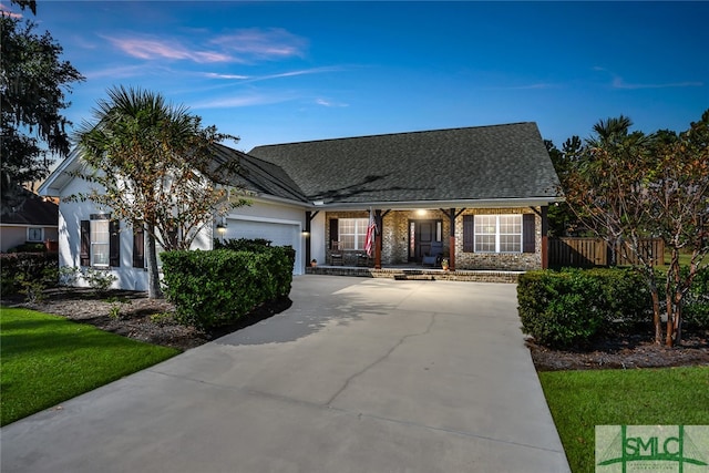 view of front facade featuring a garage and a porch