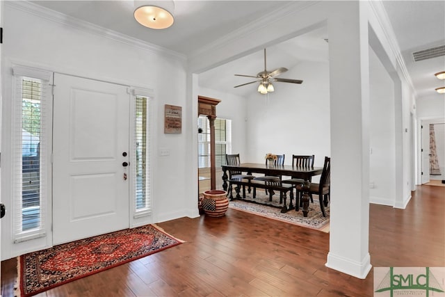 foyer featuring a wealth of natural light, ceiling fan, dark hardwood / wood-style flooring, and ornamental molding