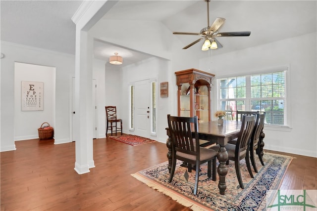 dining room featuring lofted ceiling, ceiling fan, dark hardwood / wood-style flooring, and ornamental molding