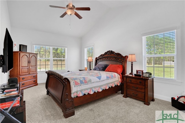 carpeted bedroom featuring high vaulted ceiling and ceiling fan