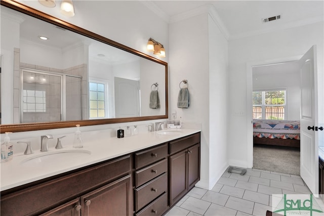 bathroom with vanity, tile patterned flooring, a shower with door, and ornamental molding