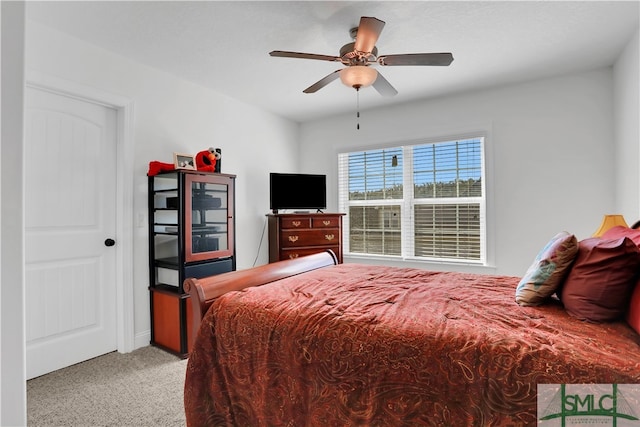 carpeted bedroom with ceiling fan