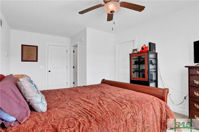 bedroom with ceiling fan and carpet floors