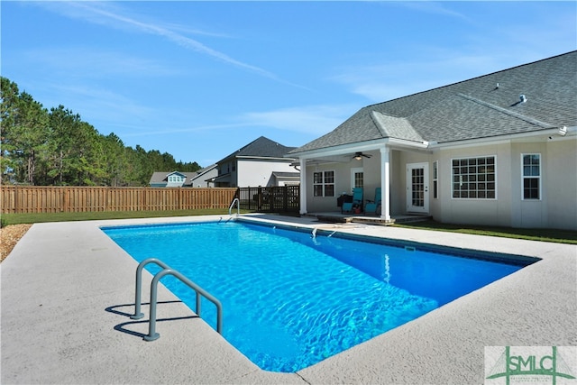 view of pool with a patio area and ceiling fan