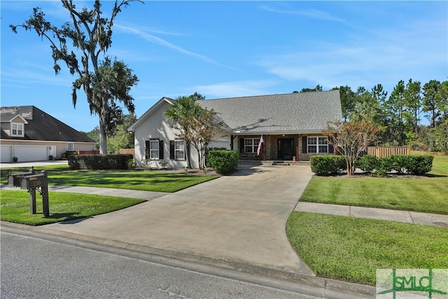 single story home featuring a garage and a front lawn