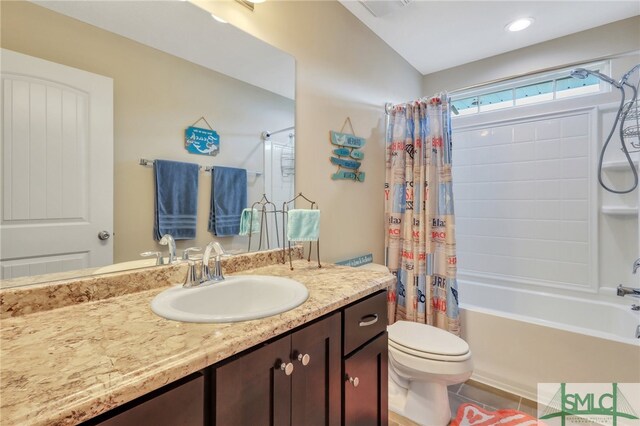 full bathroom with tile patterned flooring, shower / bath combo with shower curtain, vanity, toilet, and vaulted ceiling