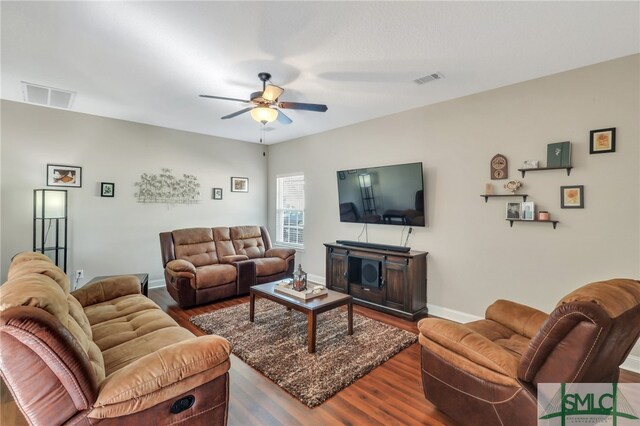 living room with ceiling fan and wood-type flooring