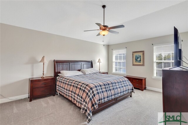 carpeted bedroom featuring ceiling fan