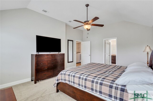 bedroom with ensuite bathroom, lofted ceiling, ceiling fan, and light carpet