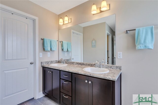 bathroom with tile patterned flooring and vanity