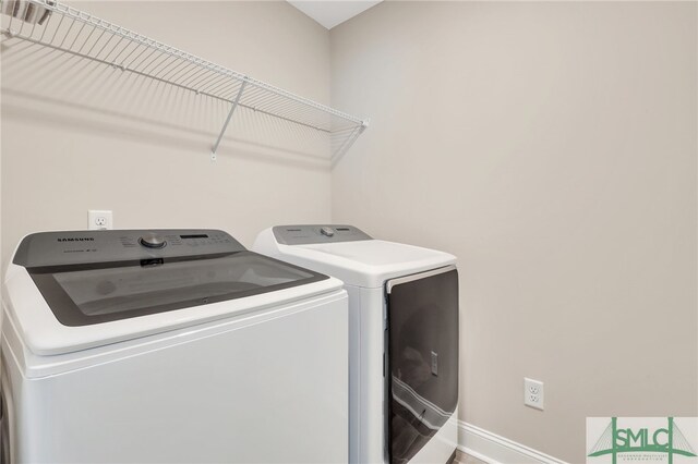 laundry room with washer and clothes dryer