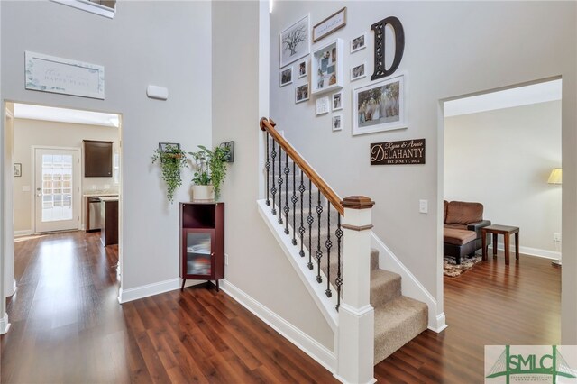 stairway featuring hardwood / wood-style floors