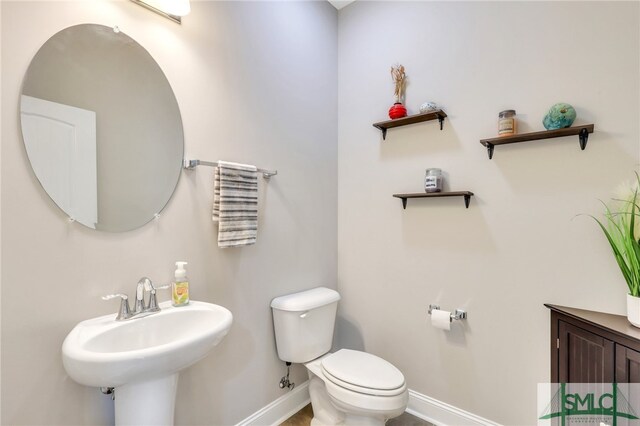 bathroom with toilet and sink