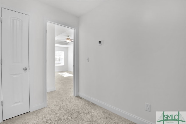 corridor with light colored carpet