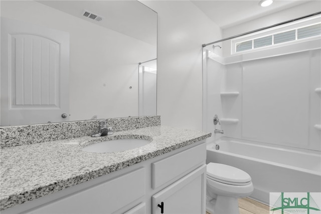 full bathroom with tile patterned floors, vanity, toilet, and tub / shower combination