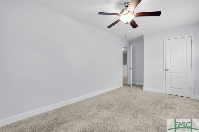 unfurnished bedroom with ceiling fan and light colored carpet