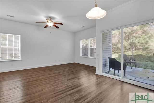 interior space with ceiling fan and dark hardwood / wood-style flooring