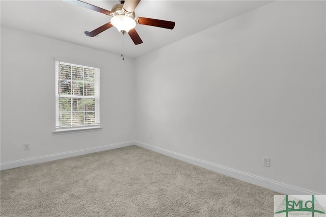 carpeted empty room featuring ceiling fan