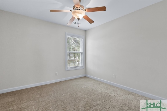 carpeted empty room featuring ceiling fan