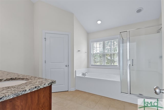 bathroom with vanity, tile patterned floors, separate shower and tub, and lofted ceiling