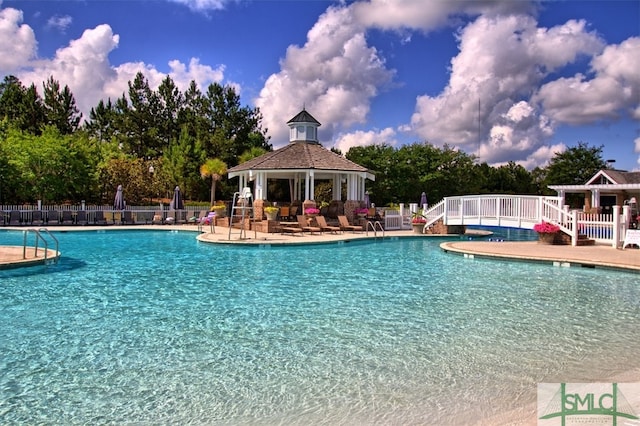 view of pool with a patio and a gazebo