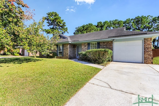 ranch-style home with a front yard and a garage