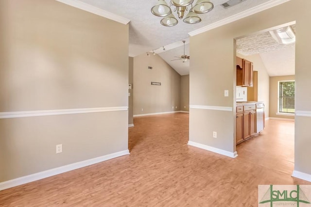 empty room with baseboards, lofted ceiling, crown molding, light wood-style floors, and ceiling fan with notable chandelier