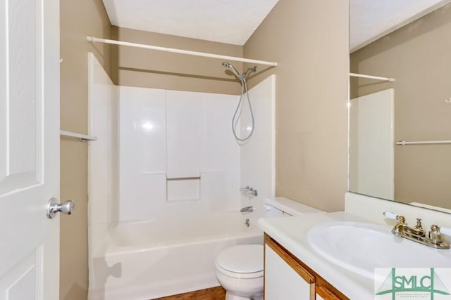 bathroom with vanity, toilet, and bathing tub / shower combination