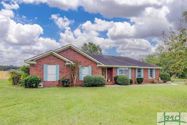 ranch-style home featuring a front yard