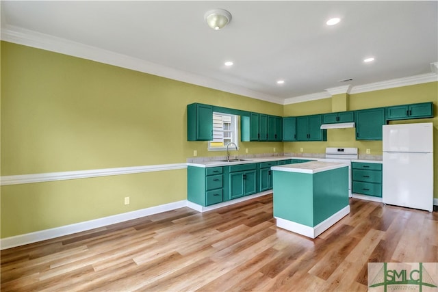 kitchen with sink, crown molding, white fridge, light wood-type flooring, and green cabinetry