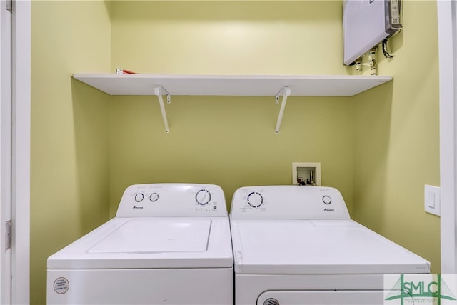 washroom with independent washer and dryer