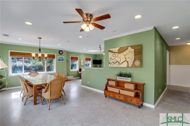 dining area featuring ceiling fan with notable chandelier, a skylight, and ornamental molding