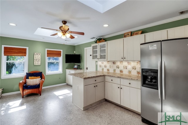 kitchen featuring kitchen peninsula, stainless steel fridge with ice dispenser, crown molding, backsplash, and white cabinetry