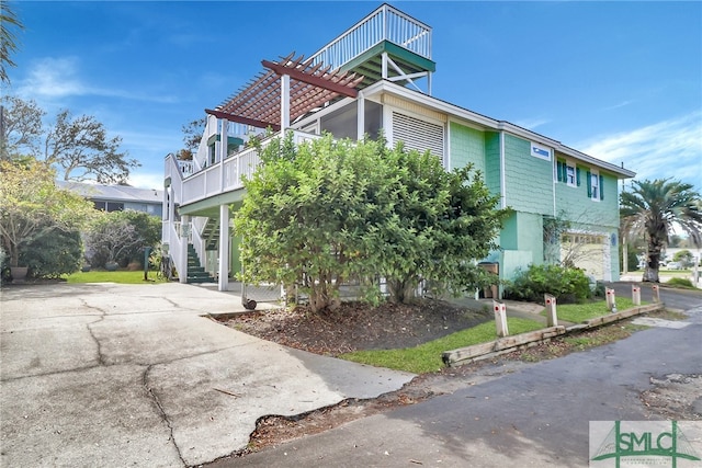 view of home's exterior featuring a balcony