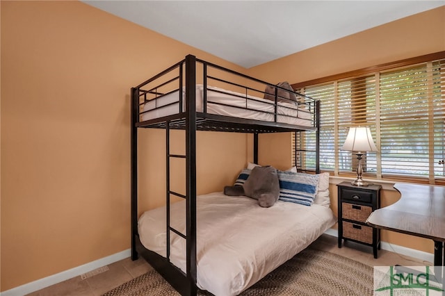 bedroom featuring tile patterned flooring