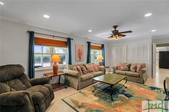 living room featuring ceiling fan and crown molding