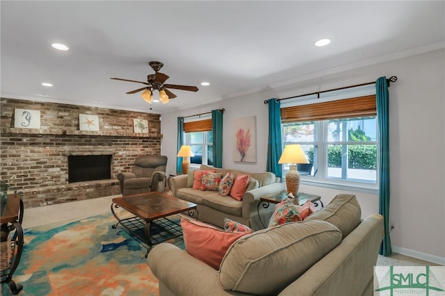 carpeted living room featuring a fireplace, ceiling fan, and crown molding